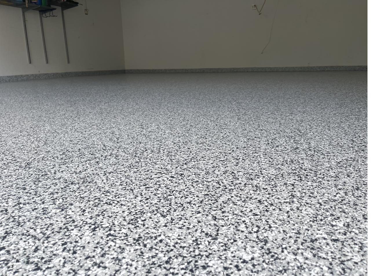 Full broadcast flake epoxy garage floor with polyaspartic topcoat